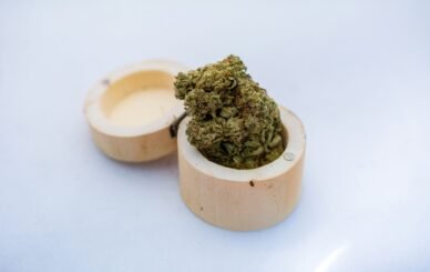 green kush on brown wooden bowl